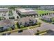 Beautiful townhouse with grey exterior, landscaping, and charming street appeal in a well-maintained community at 2694 Giardino Loop, Kissimmee, FL 34741