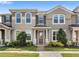 Inviting townhome with a well-maintained front yard and charming architectural details at 2694 Giardino Loop, Kissimmee, FL 34741
