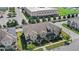Gorgeous townhouse with grey exterior, landscaping, and front porches in a well-maintained community at 2694 Giardino Loop, Kissimmee, FL 34741