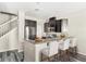 Stylish kitchen featuring granite counters, stainless appliances, breakfast bar, and a bright, airy feel at 2694 Giardino Loop, Kissimmee, FL 34741