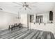 Open-concept living area with updated floors, and combined dining and kitchen spaces at 2694 Giardino Loop, Kissimmee, FL 34741