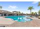 Community pool with a clear blue water, and the clubhouse in the background at 2694 Giardino Loop, Kissimmee, FL 34741