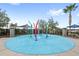 Community splash pad featuring colorful water features and a seating area for relaxation on a sunny day at 2694 Giardino Loop, Kissimmee, FL 34741