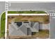 Stunning aerial view of a modern home featuring solar panels and well-manicured landscaping at 3002 Voyager Ave, St Cloud, FL 34771