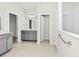 The primary bathroom includes dual vanities, neutral paint, tile flooring, and separate rooms for bath and toilet at 3002 Voyager Ave, St Cloud, FL 34771