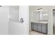 This bathroom features a tiled shower, vanity with storage, and modern fixtures, offering a clean and functional design at 3002 Voyager Ave, St Cloud, FL 34771
