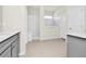 The primary bathroom includes dual vanities, neutral paint, tile flooring, and separate shower room at 3002 Voyager Ave, St Cloud, FL 34771