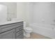 Clean bathroom featuring a grey vanity and a shower/tub combo at 3002 Voyager Ave, St Cloud, FL 34771