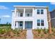 Charming two-story home with a covered porch and balcony and fresh landscaping at 3002 Voyager Ave, St Cloud, FL 34771