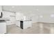 Modern kitchen with stainless appliances, center island, and tile flooring offering lots of space at 3002 Voyager Ave, St Cloud, FL 34771