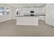 Modern kitchen featuring a center island, granite countertops and stainless appliances and white cabinetry at 3002 Voyager Ave, St Cloud, FL 34771