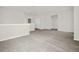 Bright, carpeted loft area offers versatile space for a playroom, office, or additional living area at 3002 Voyager Ave, St Cloud, FL 34771