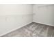 A simple yet functional walk-in closet with wire shelving provides practical storage solutions in this home at 3002 Voyager Ave, St Cloud, FL 34771