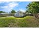 Spacious backyard with a patio and deck, surrounded by a wood fence at 3151 S Bumby Ave, Orlando, FL 32806