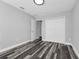 This bedroom features modern gray walls, hardwood floors and bright white door frames and baseboards at 3151 S Bumby Ave, Orlando, FL 32806