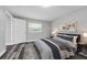 Cozy bedroom with a large window, modern decor, and hardwood flooring at 3151 S Bumby Ave, Orlando, FL 32806