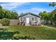 Cozy home with vibrant landscaping set against a lush green lawn and privacy fence at 3151 S Bumby Ave, Orlando, FL 32806
