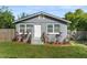 Charming home featuring updated siding, complemented by fresh landscaping and a well-maintained lawn at 3151 S Bumby Ave, Orlando, FL 32806