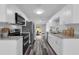 Bright, modern kitchen featuring stainless steel appliances, granite counters and white cabinetry at 3151 S Bumby Ave, Orlando, FL 32806