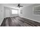 Bright room with modern laminate flooring and lots of natural light through updated windows at 3151 S Bumby Ave, Orlando, FL 32806