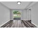 Living room features sliding glass doors leading to a small deck and backyard at 3151 S Bumby Ave, Orlando, FL 32806