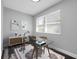 This office area is decorated with neutral walls, a glass desk and a brightly lit window at 3151 S Bumby Ave, Orlando, FL 32806