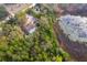 Overhead of the property featuring a pool and backing onto a marshy lake at 38851 Forest Dr, Eustis, FL 32736
