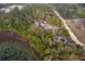A home in a forest, next to a lake, aerial view at 38851 Forest Dr, Eustis, FL 32736