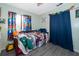 Vibrant bedroom featuring colorful accents, themed decorations, and comic book details at 38851 Forest Dr, Eustis, FL 32736