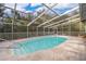 A screened-in pool with clear water, steps for entry, and a surrounding concrete deck at 38851 Forest Dr, Eustis, FL 32736