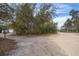 Street view of home's driveway among the trees at 38851 Forest Dr, Eustis, FL 32736
