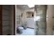 Bathroom featuring white tile floors, a toilet, bidet and shower with glass doors under a skylight at 39 Fellowship Dr, Palm Coast, FL 32137