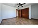 Bedroom featuring tile floors, a ceiling fan and double closets at 39 Fellowship Dr, Palm Coast, FL 32137
