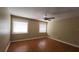 Comfortable bedroom featuring a ceiling fan and two windows providing natural light at 39 Fellowship Dr, Palm Coast, FL 32137