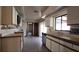 Spacious kitchen features ample counter space and a sink with backyard views at 39 Fellowship Dr, Palm Coast, FL 32137
