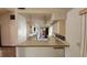 Bright kitchen with light-colored cabinets and a functional layout with views into other rooms at 39 Fellowship Dr, Palm Coast, FL 32137