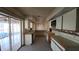 Full kitchen with white cabinets and access to both the pool area and breakfast nook at 39 Fellowship Dr, Palm Coast, FL 32137