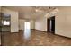 Open-concept living room with tile flooring, ceiling fan, and sliding glass doors to the outdoor area at 39 Fellowship Dr, Palm Coast, FL 32137
