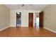 Bedroom featuring neutral walls, a ceiling fan, closet, and ensuite bathroom at 39 Fellowship Dr, Palm Coast, FL 32137