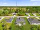 Aerial view of neighborhood homes, school, and the surrounding trees at 3984 Sw 151St St, Ocala, FL 34473