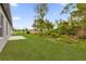 Expansive backyard featuring lush green grass and a private wooded area at 3984 Sw 151St St, Ocala, FL 34473