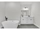 Bathroom featuring double vanity, modern fixtures and standalone tub at 3984 Sw 151St St, Ocala, FL 34473