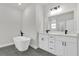 Bathroom featuring double vanity, modern fixtures and standalone tub at 3984 Sw 151St St, Ocala, FL 34473