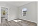 Bedroom with a bright window, hardwood floors, and neutral paint colors at 3984 Sw 151St St, Ocala, FL 34473