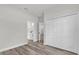 Bedroom with a closet and bathroom access, with hardwood floors at 3984 Sw 151St St, Ocala, FL 34473