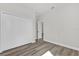 Bedroom with wood-look flooring and closet with sliding doors at 3984 Sw 151St St, Ocala, FL 34473