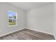 Bedroom with a bright window, hardwood floors, and neutral paint colors at 3984 Sw 151St St, Ocala, FL 34473