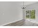 Minimalist dining area featuring sliding glass doors with view to the backyard at 3984 Sw 151St St, Ocala, FL 34473