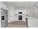 Sleek kitchen featuring stainless steel appliances, white cabinetry, and quartz countertops at 3984 Sw 151St St, Ocala, FL 34473