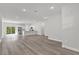 Spacious open-concept living room with recessed lights and hardwood floors and kitchen view at 3984 Sw 151St St, Ocala, FL 34473